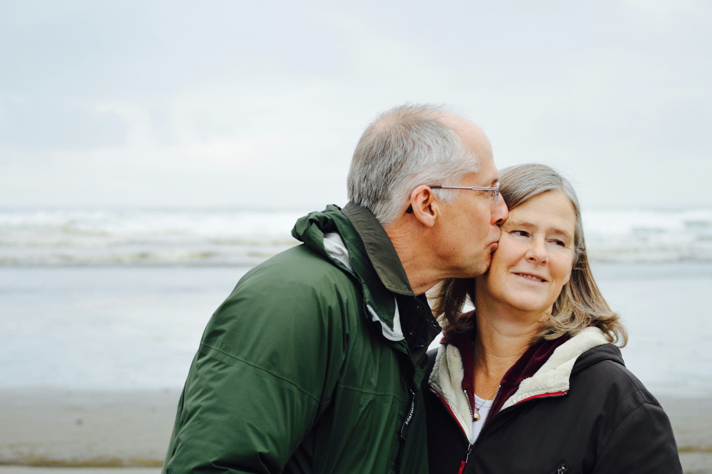 An older couple embracing outdoors, reflecting the support around online psychiatric care in Florida