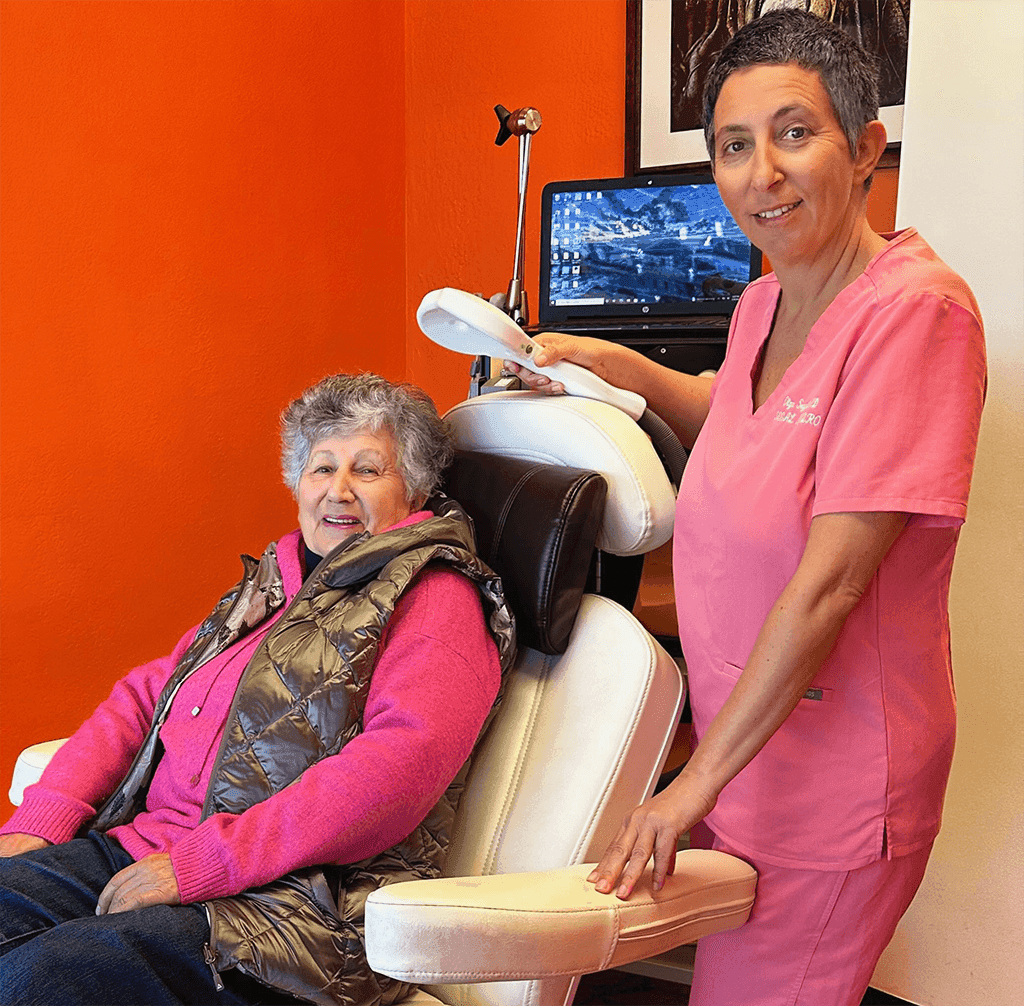 TMS treatment session showing magnetic stimulation device targeting the brain